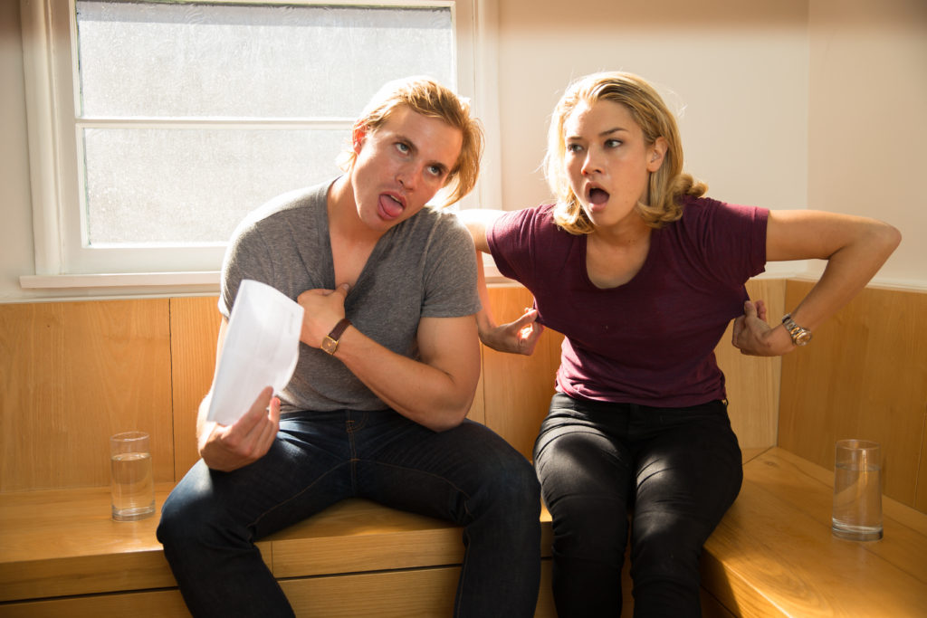 sweaty couple trying to cool down in need of air conditioning