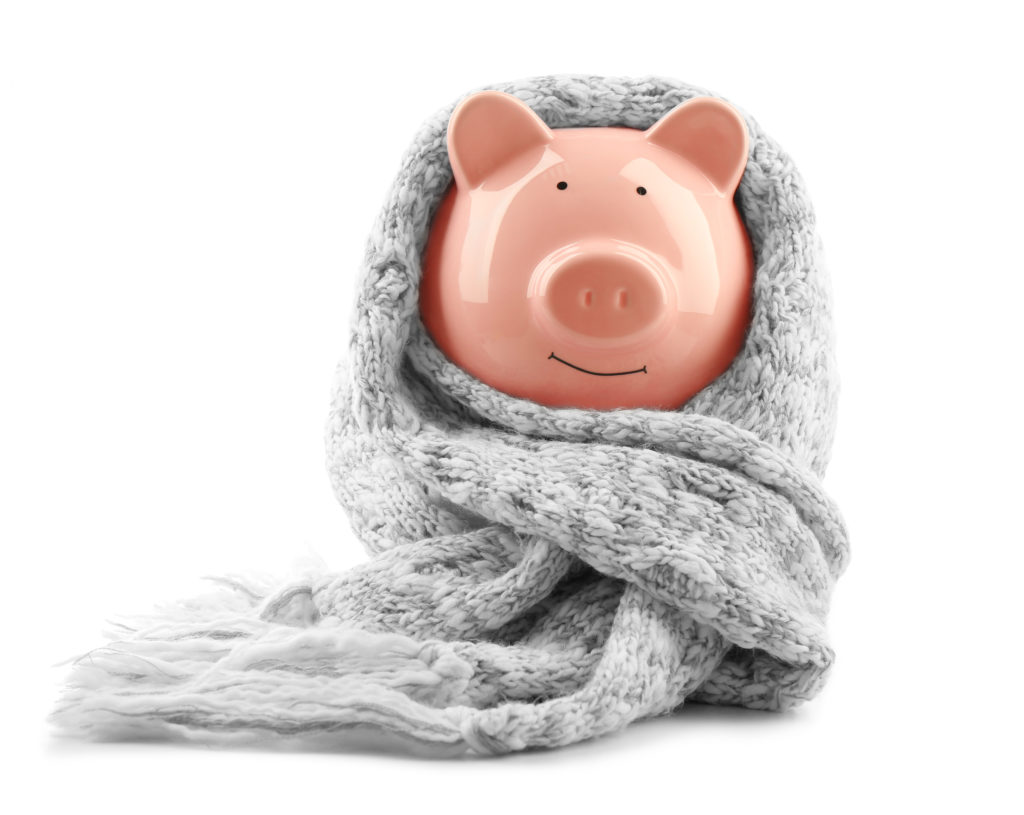 piggy bank wrapped in a gray scarf