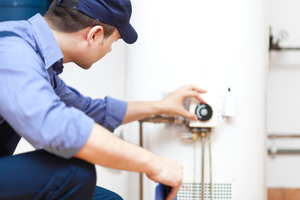 technician performing heating repair