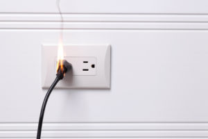 Outlet and plug catch on fire due to neglect from a home owner