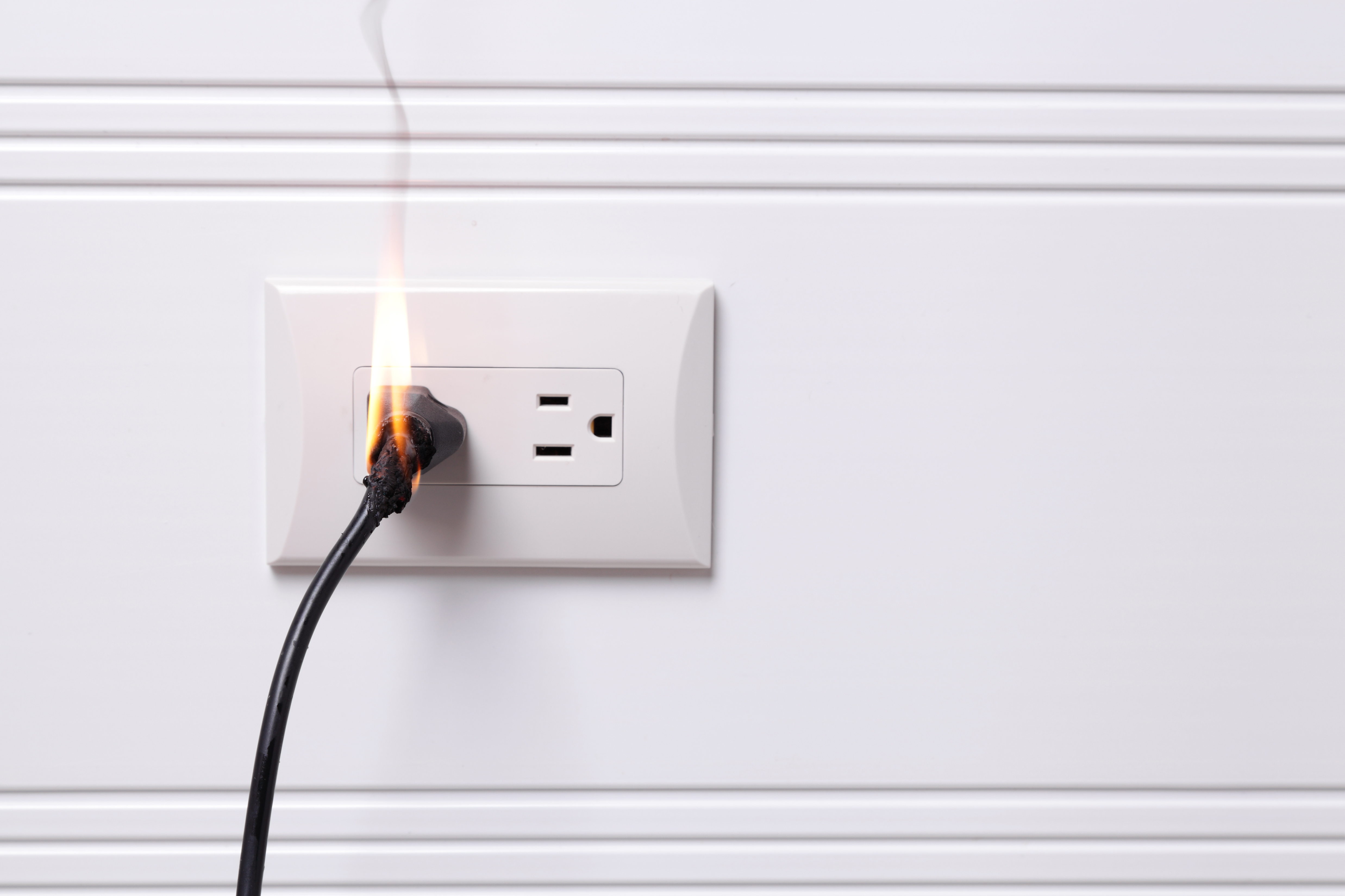 Outlet and plug catch on fire due to neglect from a home owner
